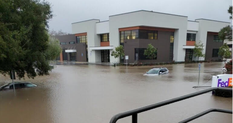 Flooding in parking lot on Sacramento Drive in SLO